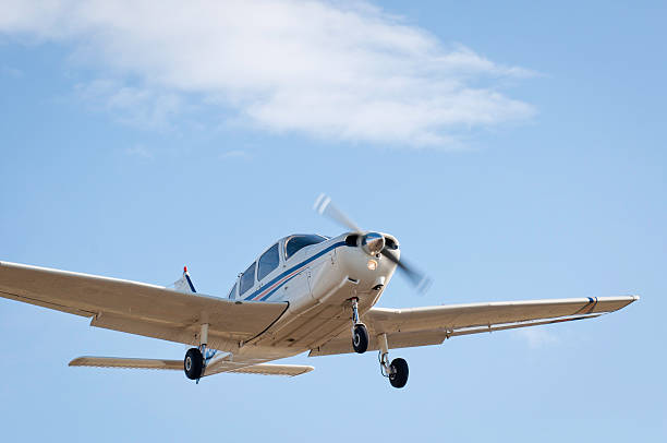 Small plane landing A passenger airplane is preparing for landing. flapping wings photos stock pictures, royalty-free photos & images