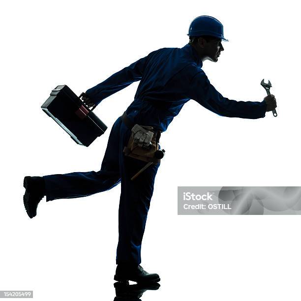 Foto de Reparo Urgência Silhueta De Homem Trabalhador De Corrida e mais fotos de stock de Correr