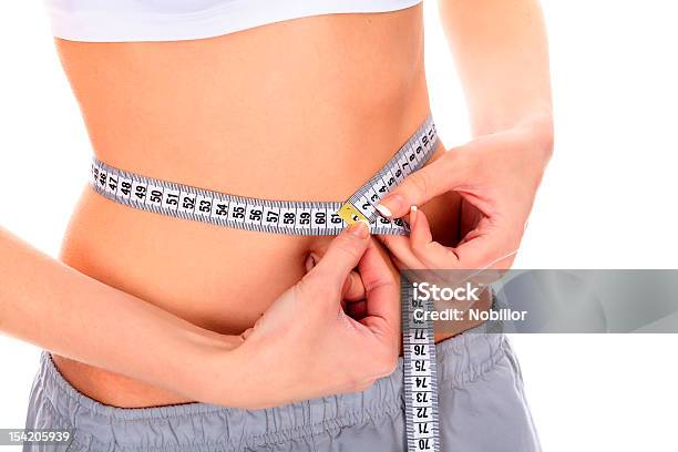 Woman Measuring Her Waistline Stock Photo - Download Image Now - Abdomen, Adult, Beautiful People