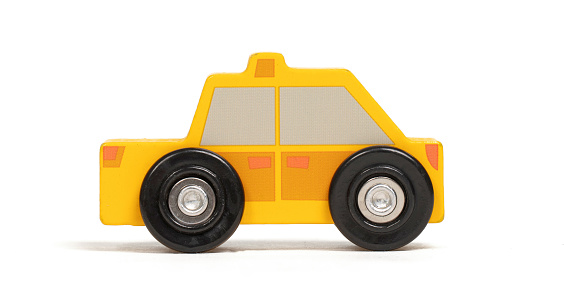 Retro wooden toy car isolated on a white background