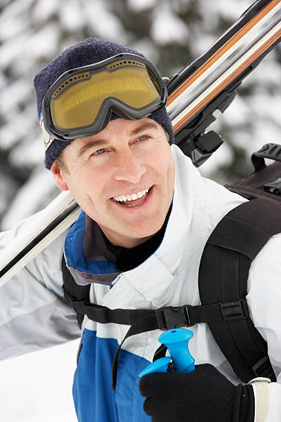 istock Middle Aged Man On Ski Holiday In Mountains 154212801