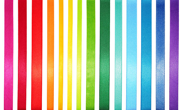 A striped colored spectrum of rainbow colors Spectrum of multi colored satin ribbons. ribbon sewing item photos stock pictures, royalty-free photos & images