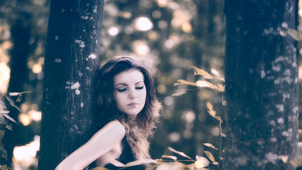 istock Young woman in the forest 154214602