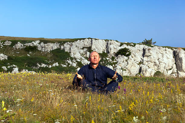 Solar meditation in mountains stock photo
