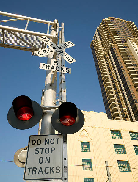 istock Railroad Crossing Tracks Warning Signal Lights Downtown 154215354