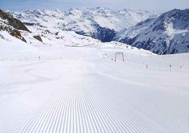 Fresh ski track at Soelden glacier Untouched fresh ski track at Solden with lines and beautiful mountains at background tiefenbach stock pictures, royalty-free photos & images