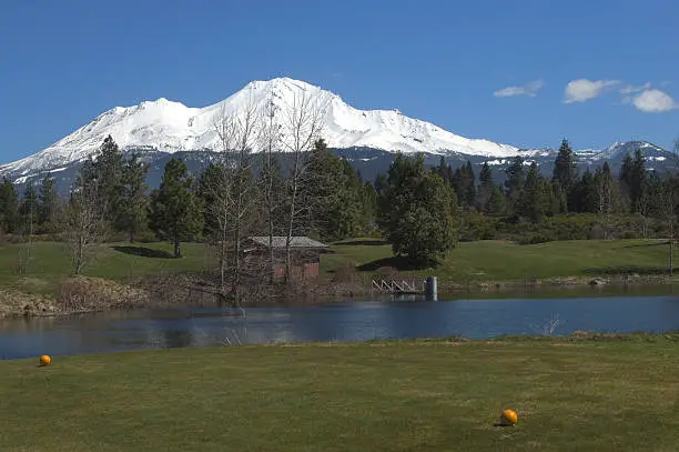 Mount Shasta 14,179 ft is located at the southern end of the Cascade Range in Siskiyou County, California. It is the 5th highest peak in California. It is of volcanic origin and last erupted in 1786. It is part of the Shasta-Trinity National Forest and open for recreation. Here seen from a local golf course