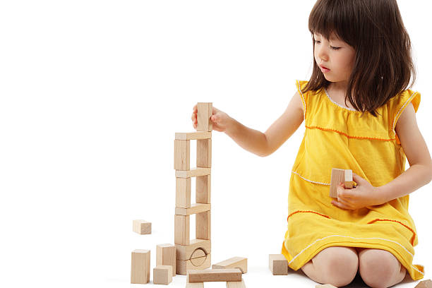 istock Little Girl Playing With Building Blocks - Isolated 154219769