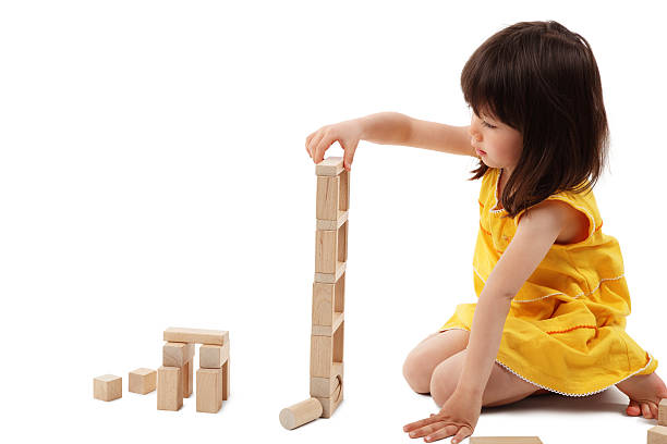istock Little Girl Playing With Building Blocks - Isolated 154219774