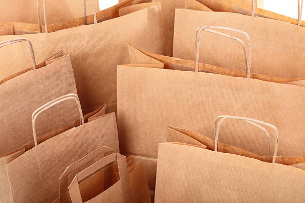 istock Shopping brown gift bags background 154220031