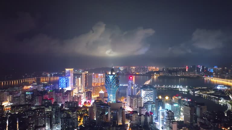 Aerial view of Macau cityscape at night.