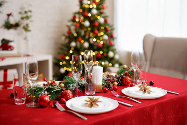 istock Served beautiful table for christmas dinner in decorated living room 1542215105