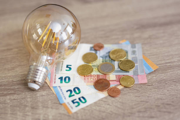 istock light bulb and euro money banknotes and coins 1542221392