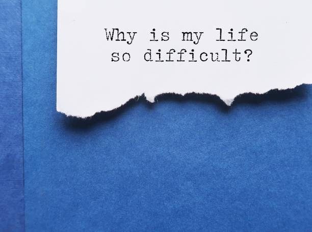 istock Torn paper on blue book with text typed question - Why is my life so difficult? -  emotional feeling with doubt when things are bad in life, feelings of being unlucky and paints oneself as a victim 1542223465