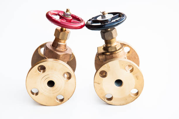 Bronze plumbing valves on a white background.