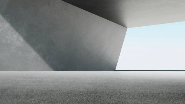 istock 3d rendering of empty concrete room with sunlight through the large window. Abstract architecture with cement floor. 1542252207