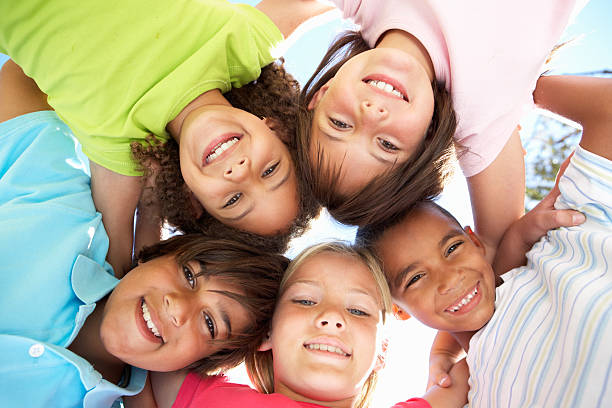 istock Group of Children Looking Down Into Camera 154225551
