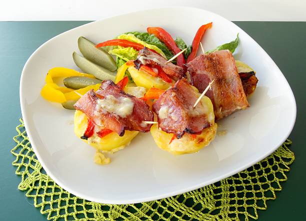 istock roasted bacon rolled with potato and vegetable salad 154227585