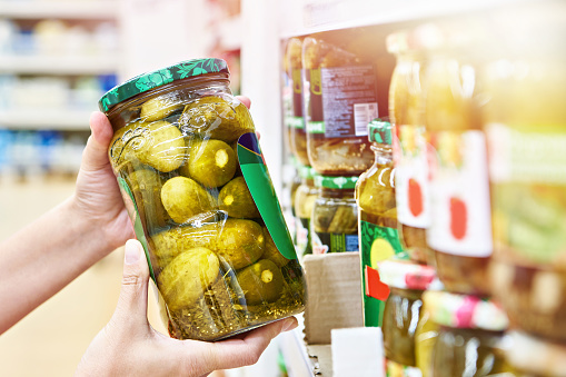Pickled cucumbers in a jar in store