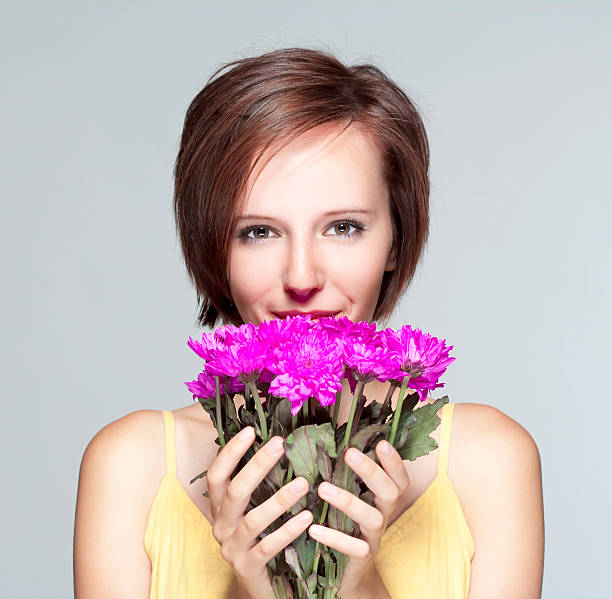 istock girl with flowers 154228210