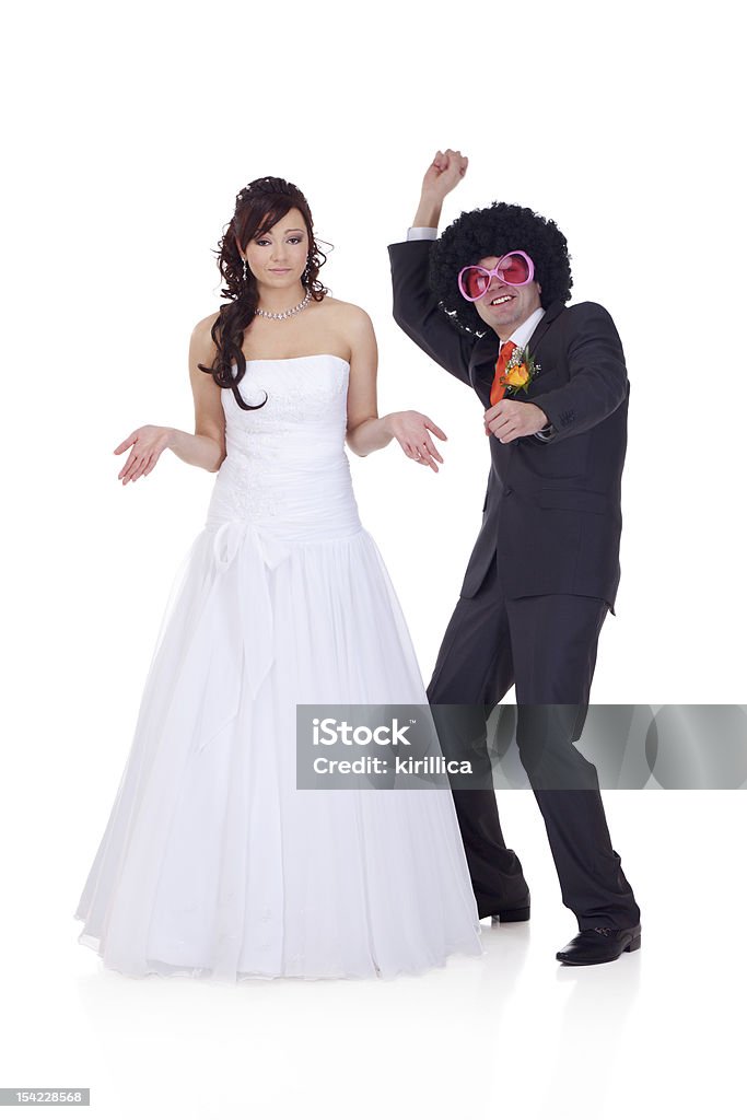 Who the guy did I marry? Bride is wondering who is the guy she did marry, because he looks like a disco dancer. Fun Stock Photo
