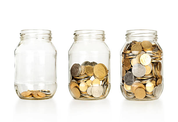 istock Glass jars with coins like diagram 154232555