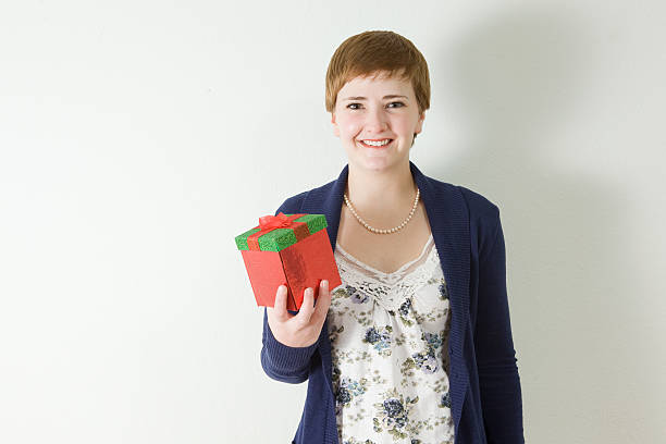 Gift giving woman stock photo