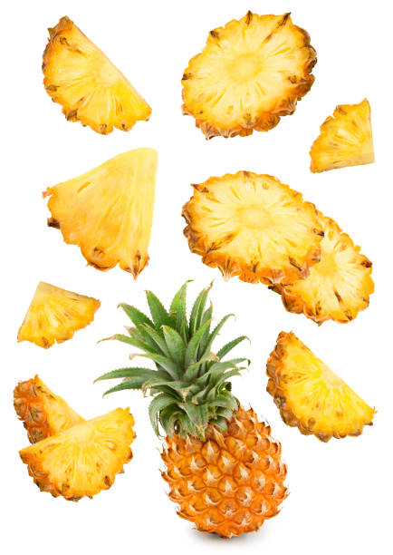 istock flying pineapple with slices isolated on white background. exotic fruit. clipping path 1542353589