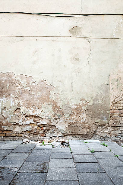 istock Aged textured street brick wall background 154236906