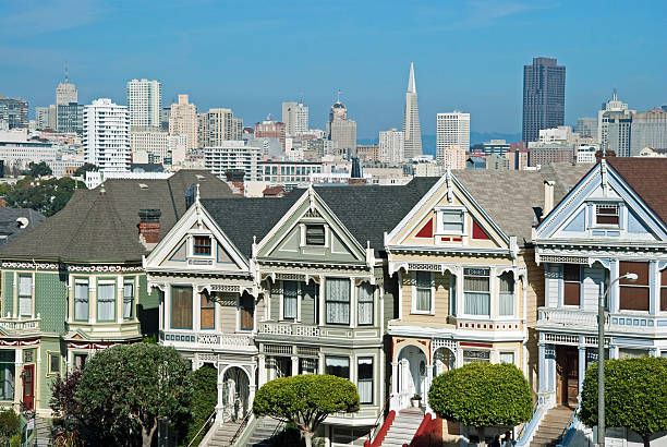 Alamo Square in San Francisco with Victorian houses Victorian houses painted ladies in San Francisco near Alamo Square transamerica pyramid san francisco stock pictures, royalty-free photos & images