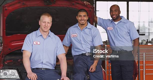 Portrait Of Auto Mechanics In Shop Stock Photo - Download Image Now - Technician, Transportation, Auto Repair Shop