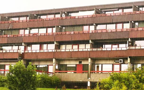 Old concrete block apartment building with large balconies