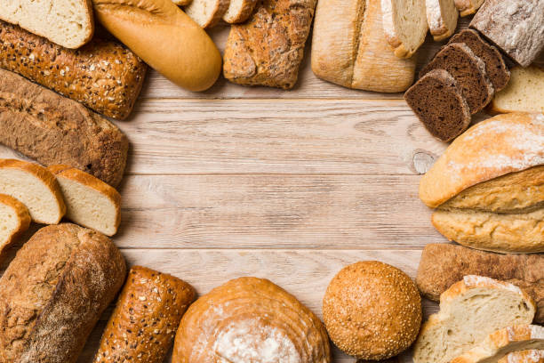 istock Homemade natural breads. Different kinds of fresh bread as background, top view with copy space 1542401099