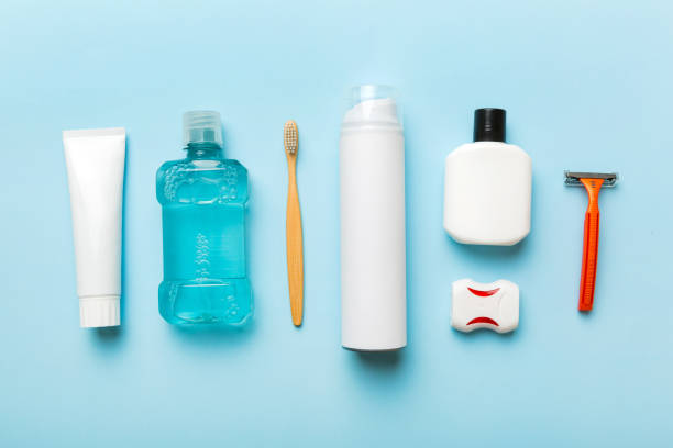 istock Mockup for bathing products top view flat lay, spa razor, toothpaste, soap, gel and other various accessories. Cosmetics for skin health. Bath Mockup for your logo 1542401111