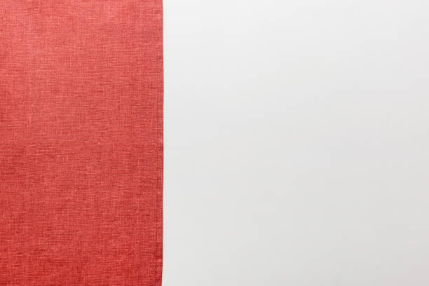 istock top view with red empty kitchen napkin isolated on table background. Folded cloth for mockup with copy space, Flat lay. Minimal style 1542401641