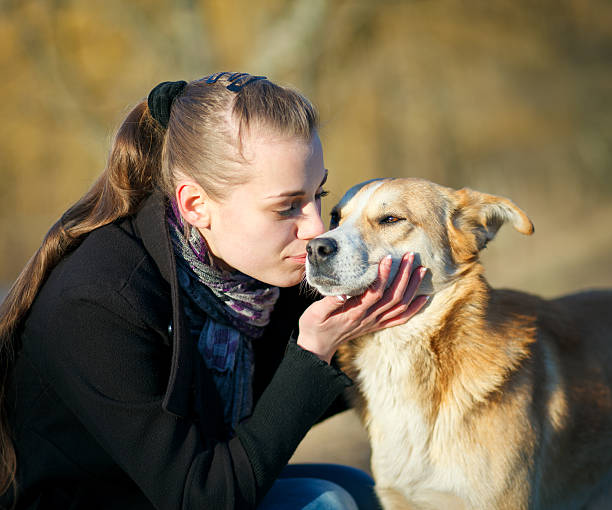 istock young woman with dog 154242865