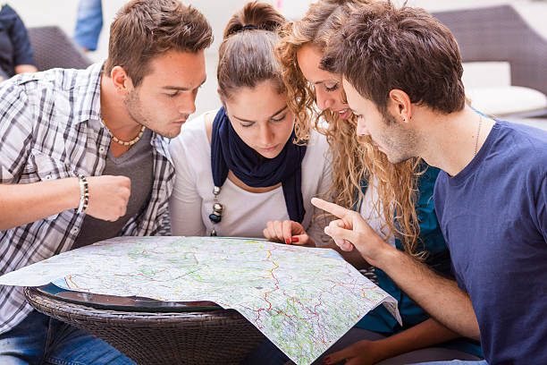 Group of Friends Checking Map stock photo