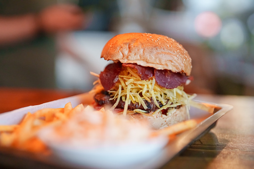 Crispy potato fries and smoked meat burger