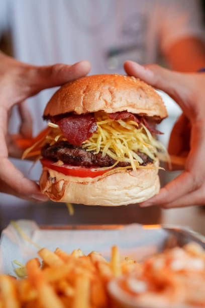 Crispy potato fries and smoked meat burger