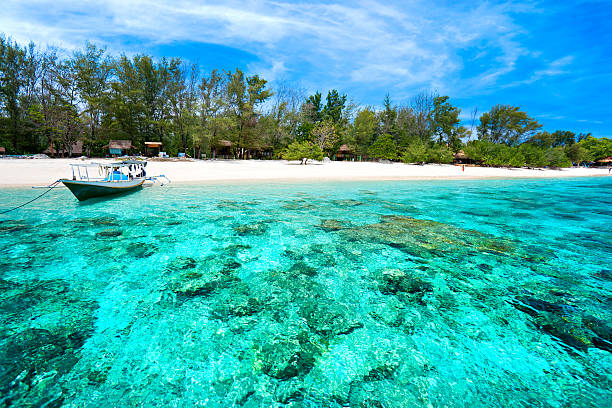 Beautiful turquoise sea of Gili Meno, Indonesia Beautiful sea of Gili Meno, with view of Gili Air. Indonesia. indo pacific ocean stock pictures, royalty-free photos & images