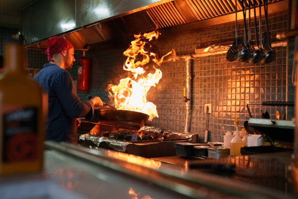 istock The chef cooking in a flaming pan 1542471180