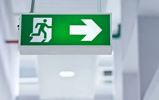 Fire exit sign in the modern building.