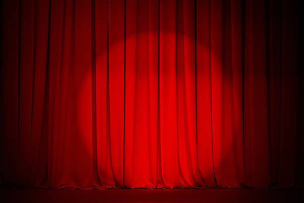 istock theatre red curtain with spot light in center 154248664