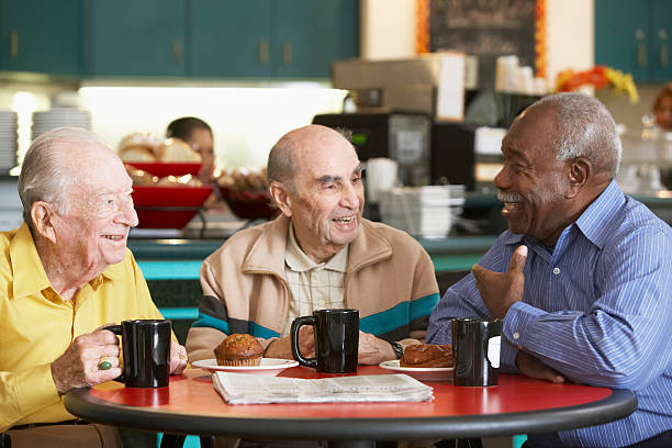 пожилые мужчины пить чай вместе - friendship cafe social gathering talking стоковые фото и изображения