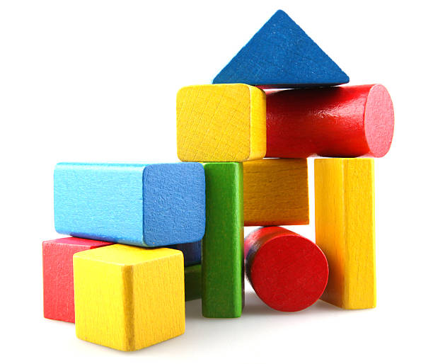 Wooden building blocks Building from wooden colourful childrens blocks green building blocks stock pictures, royalty-free photos & images