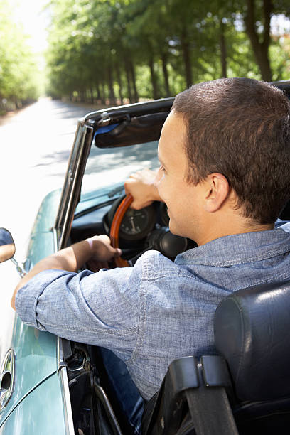 istock Man in sports car 154251001