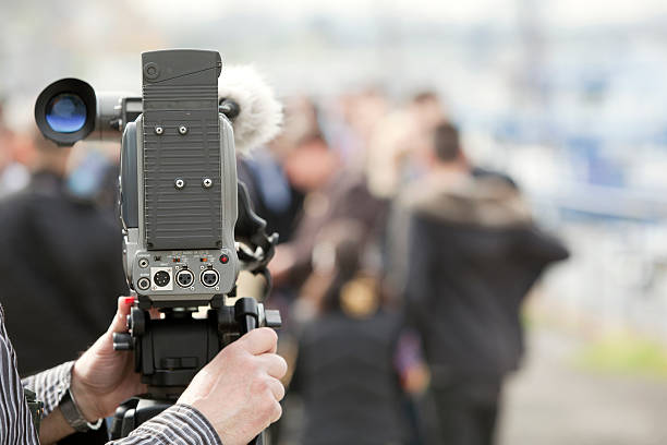 istock Covering an event with a video camera 154251213