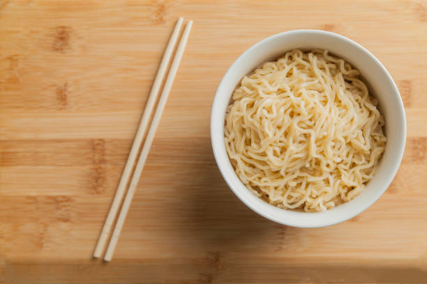 istock Ramen noodles in a bowl and chopsticks. 1542519964