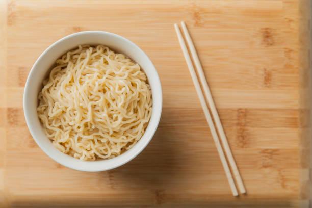 istock Ramen noodles in a bowl and chopsticks. 1542519974