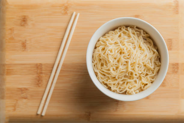 istock Ramen noodles in a bowl and chopsticks. 1542519978